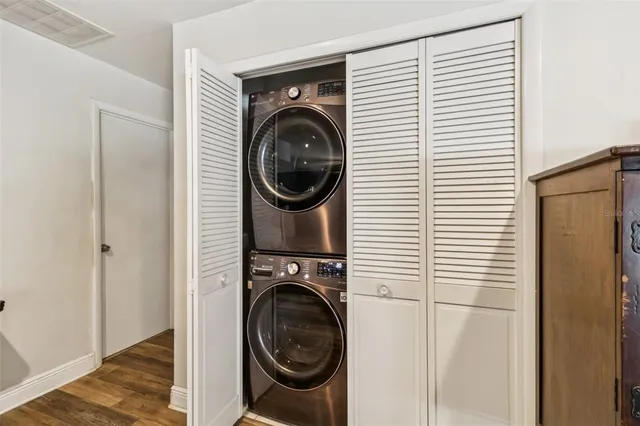 a view of a hallway with washer and dryer