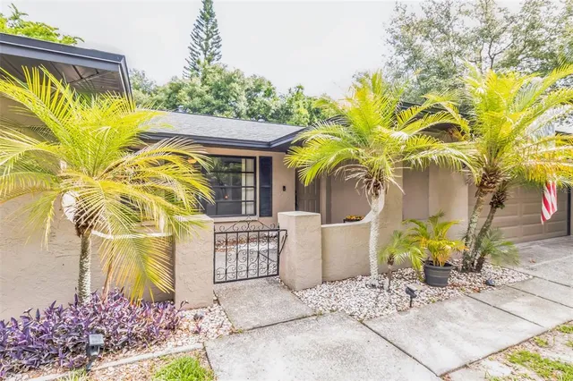 a view of a fountain in the backyard of a house