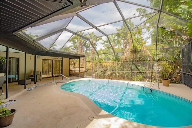 a view of swimming pool with outdoor seating