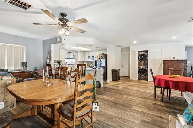 a view of a dining room with furniture and wooden floor