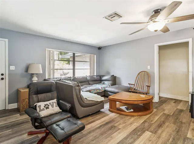 a living room with furniture and a window