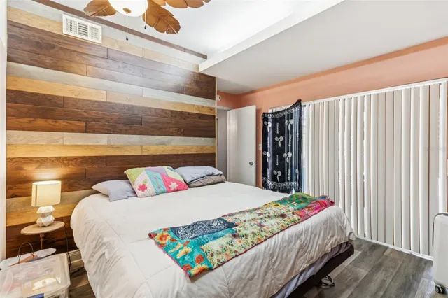 a bedroom with a bed and a window