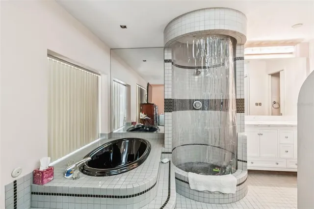 a room with a chandelier and couch