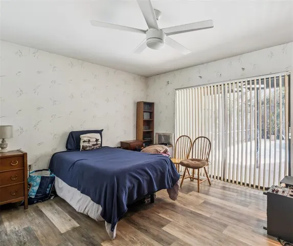 a bedroom with a bed and a table