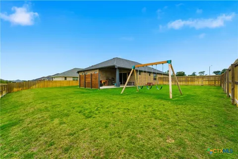 a view of a house with a big yard