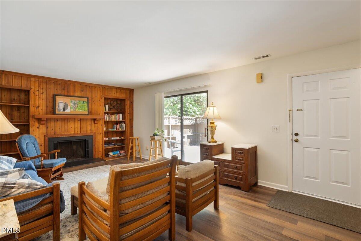 163 Springberry Lane Chapel Hill, NC 27517 - Photo 1 of 32 a living room with furniture a fireplace and a large window