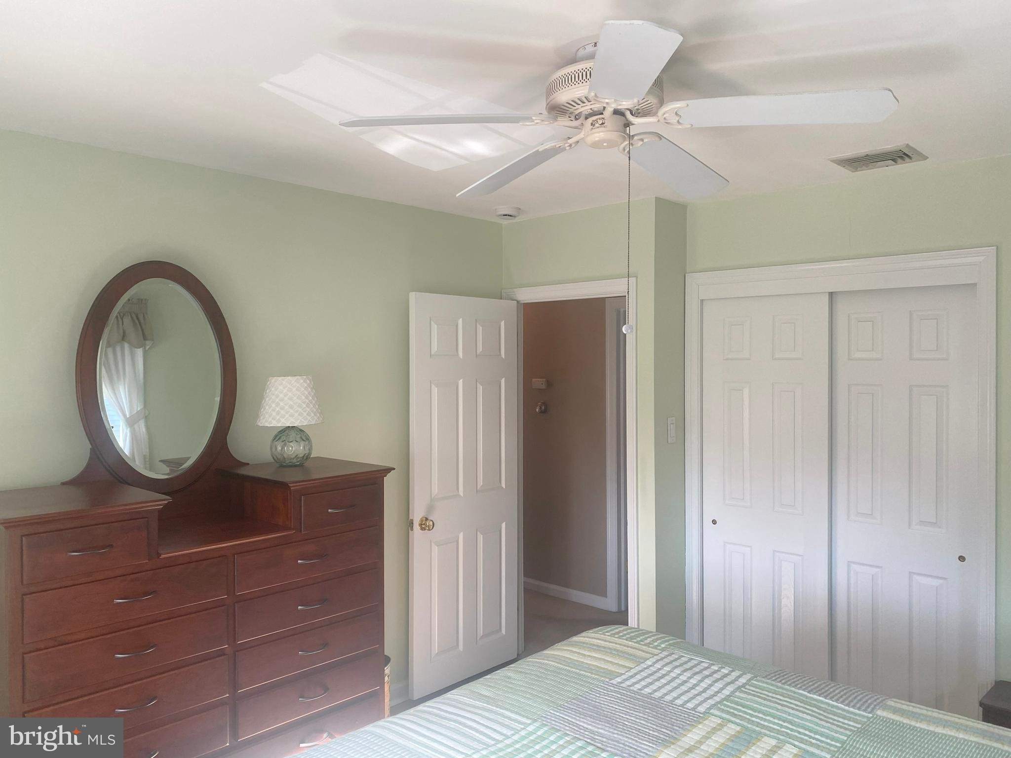 104 Sunnybrook Road Cherry Hill, NJ 08034 - Photo 14 of 39 a bedroom with a bed and a chandelier