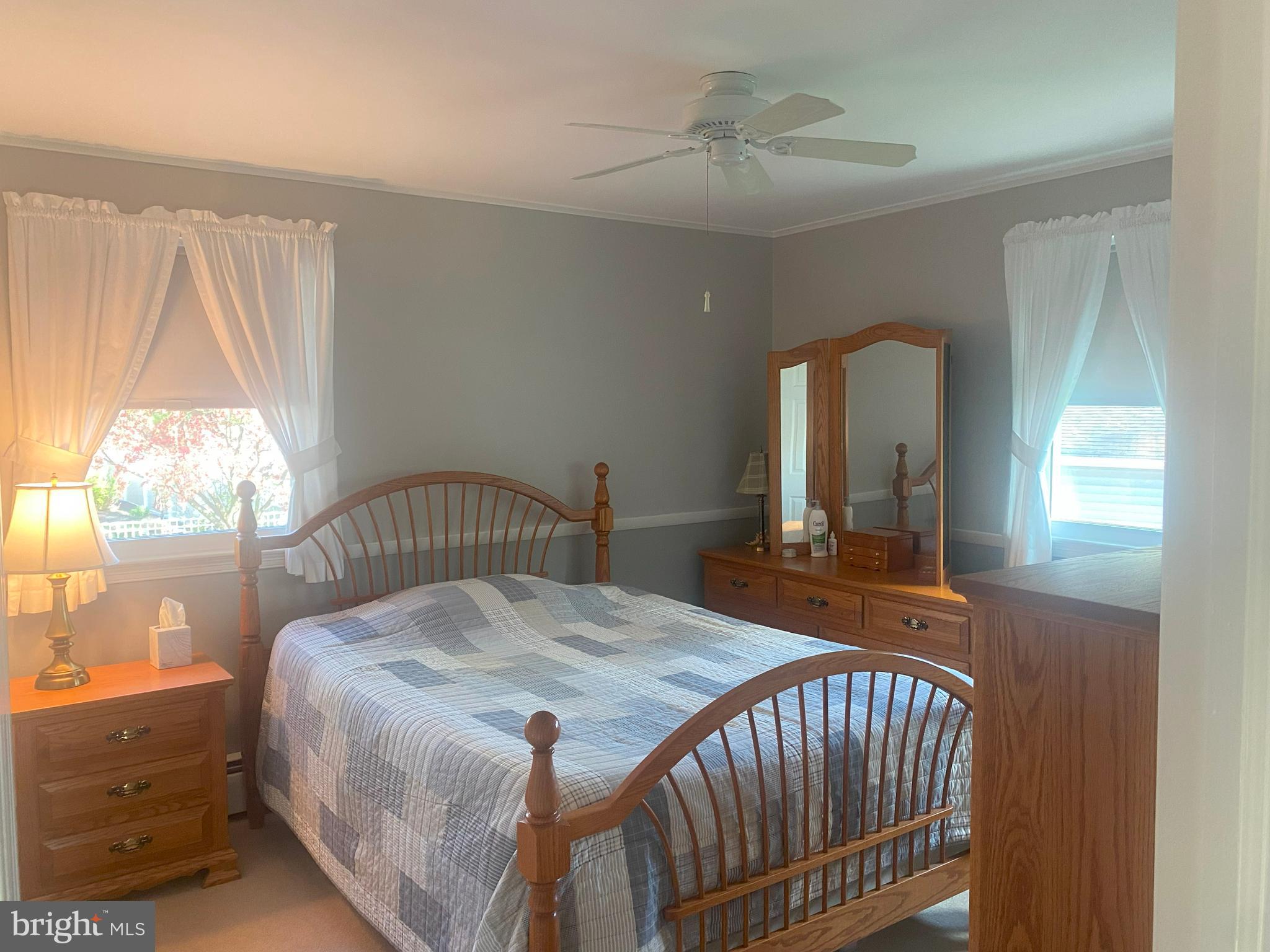 104 Sunnybrook Road Cherry Hill, NJ 08034 - Photo 15 of 39 a bedroom with a bed and a large window