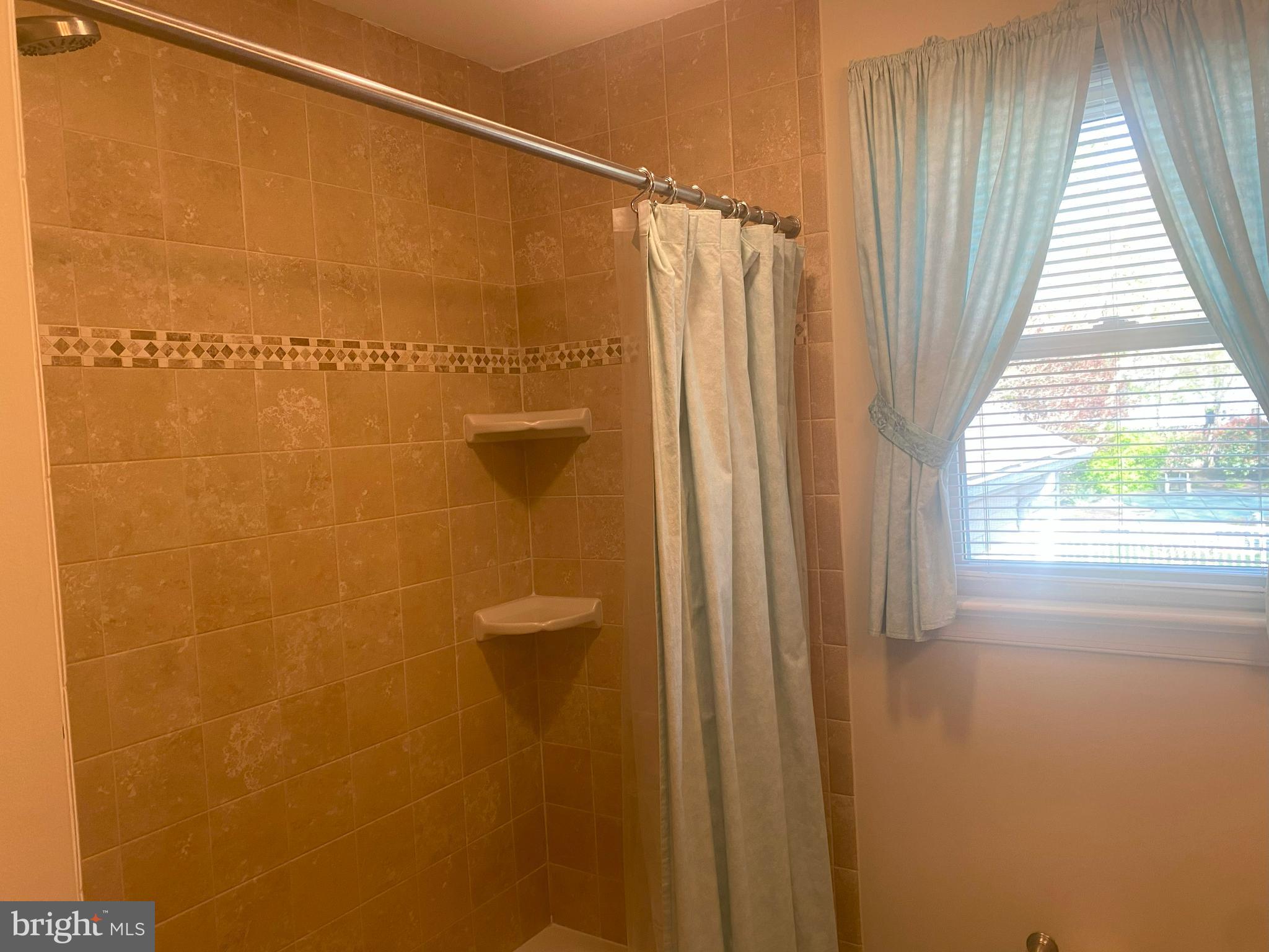 104 Sunnybrook Road Cherry Hill, NJ 08034 - Photo 20 of 39 a bathroom with a shower and a window