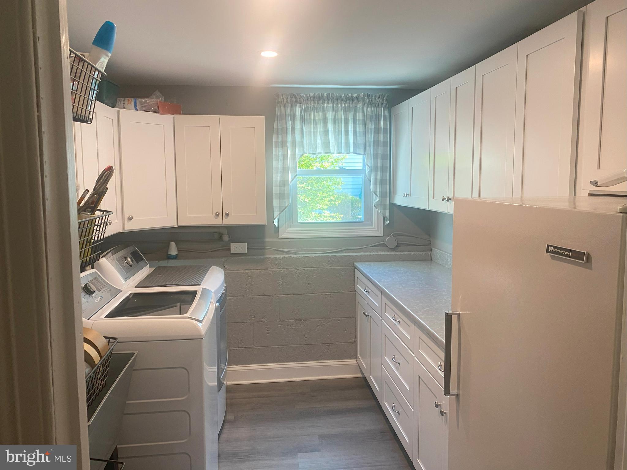 104 Sunnybrook Road Cherry Hill, NJ 08034 - Photo 24 of 39 a kitchen with a sink cabinets and a window