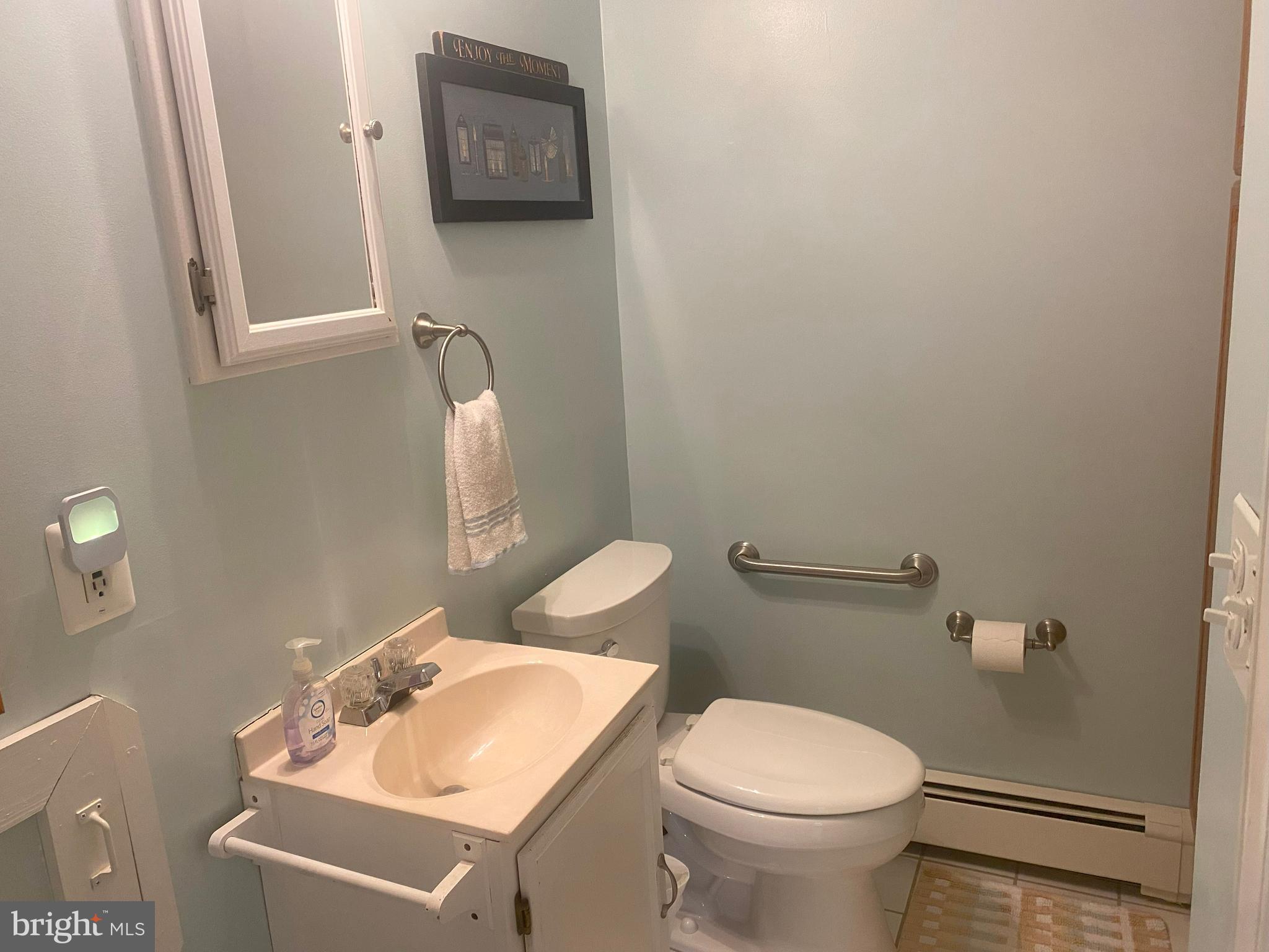 104 Sunnybrook Road Cherry Hill, NJ 08034 - Photo 26 of 39 a white toilet sitting next to a bathroom sink