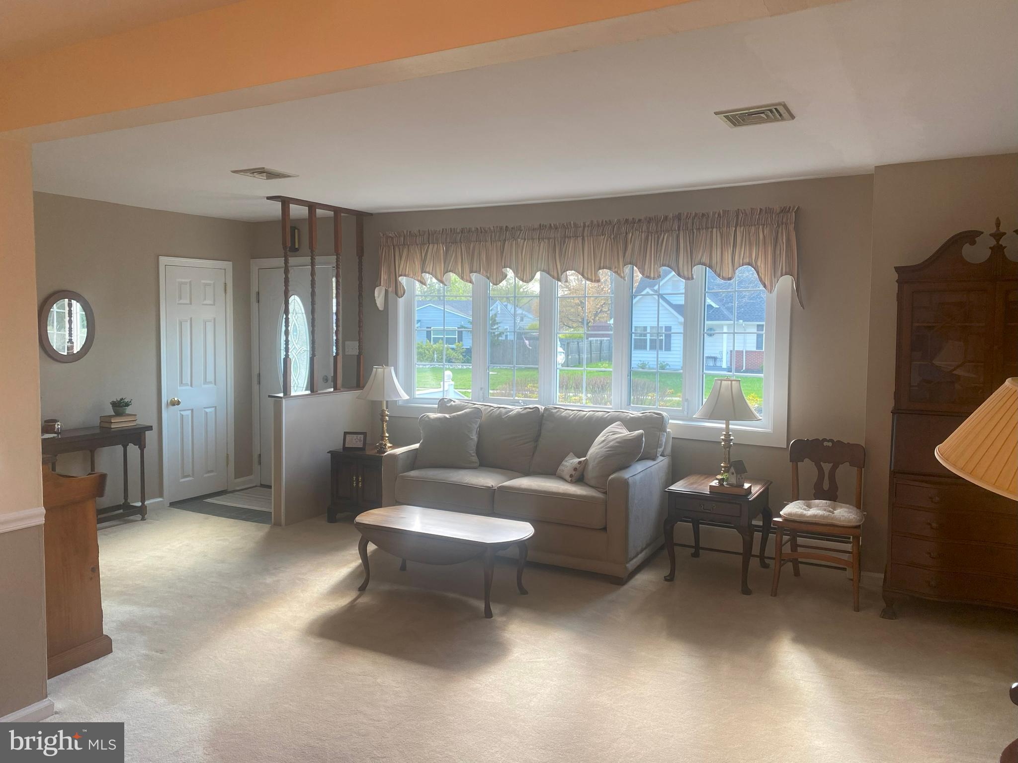 104 Sunnybrook Road Cherry Hill, NJ 08034 - Photo 3 of 39 a living room with furniture and a floor to ceiling window