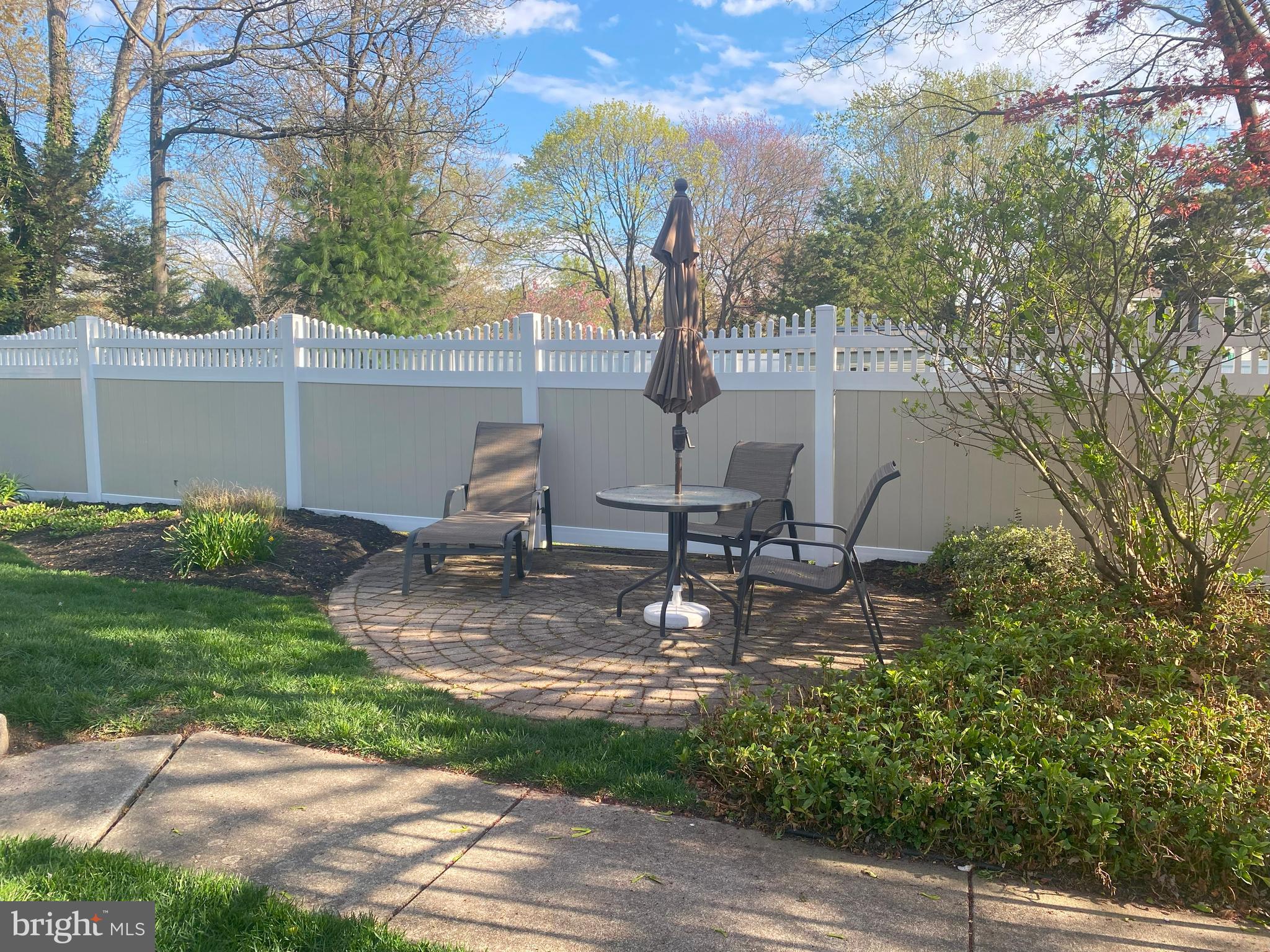 104 Sunnybrook Road Cherry Hill, NJ 08034 - Photo 36 of 39 a view of a backyard with table and chairs potted plants and large tree