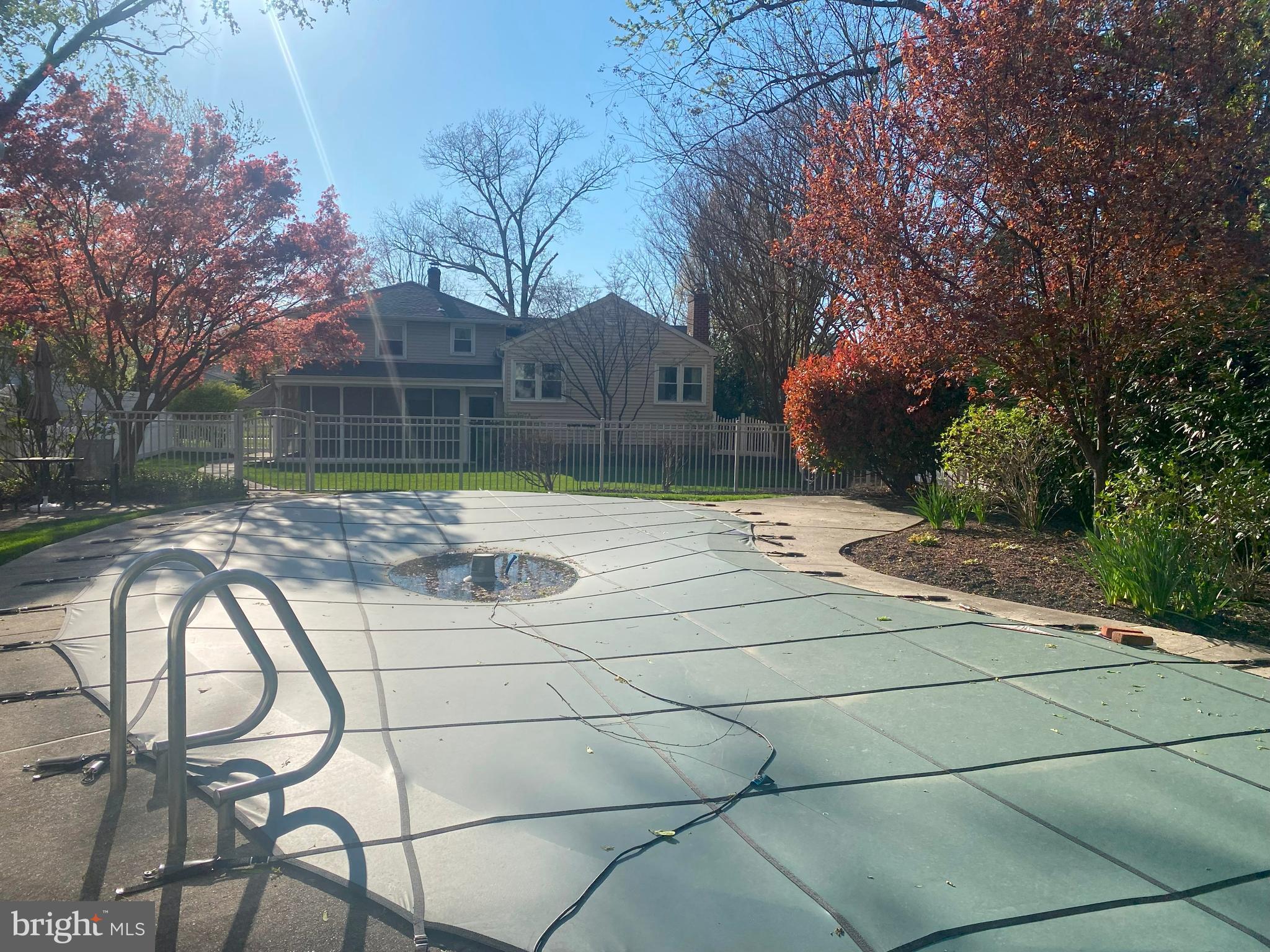 104 Sunnybrook Road Cherry Hill, NJ 08034 - Photo 39 of 39 a backyard of a house with table and chairs and a large tree