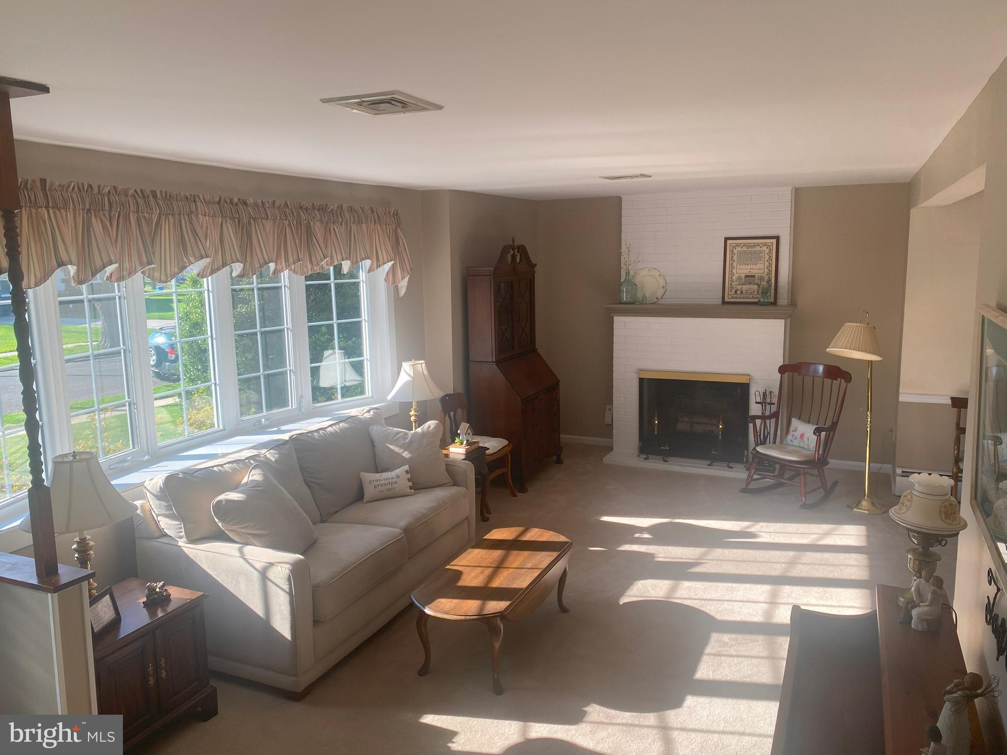 104 Sunnybrook Road Cherry Hill, NJ 08034 - Photo 4 of 39 a living room with furniture and a fireplace