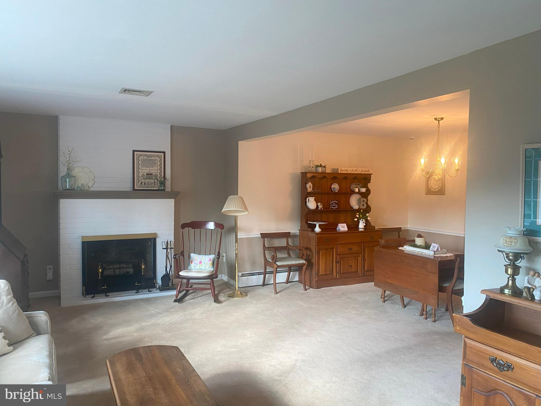 104 Sunnybrook Road Cherry Hill, NJ 08034 - Photo 5 of 39 a living room with furniture a fireplace and dining table