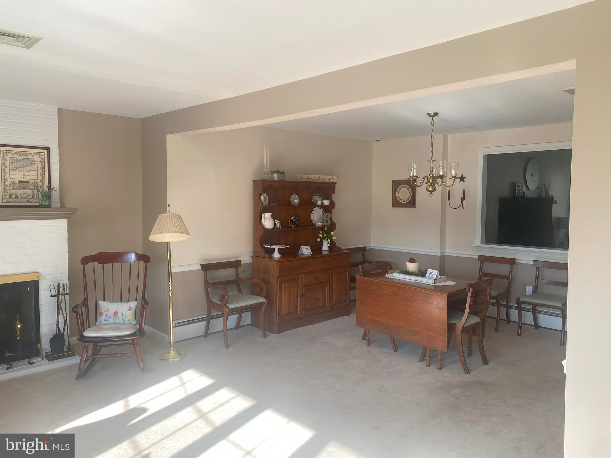 104 Sunnybrook Road Cherry Hill, NJ 08034 - Photo 6 of 39 a living room with furniture a rug and a fireplace