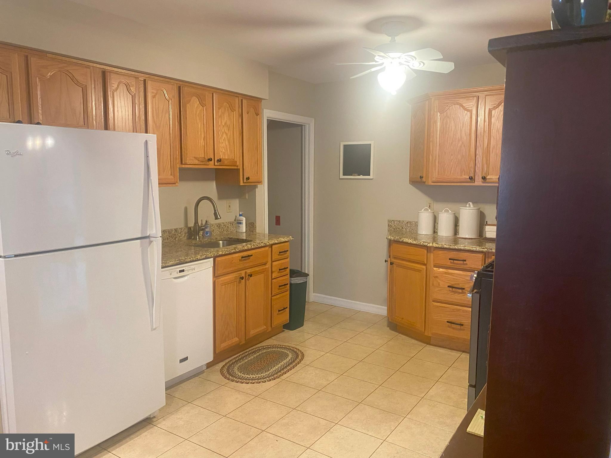 104 Sunnybrook Road Cherry Hill, NJ 08034 - Photo 8 of 39 a kitchen with a refrigerator sink stove and cabinets