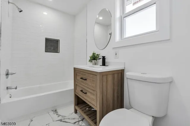 a bathroom with a sink toilet and bathtub