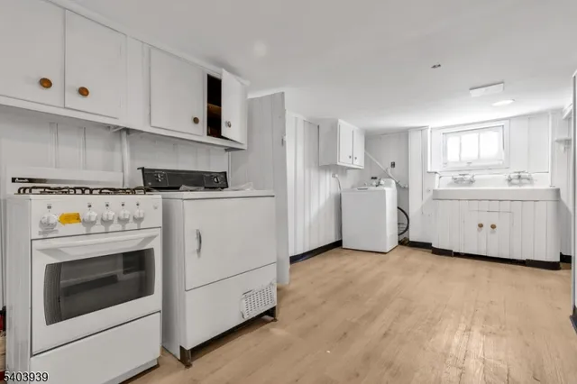 a kitchen with cabinets and white appliances