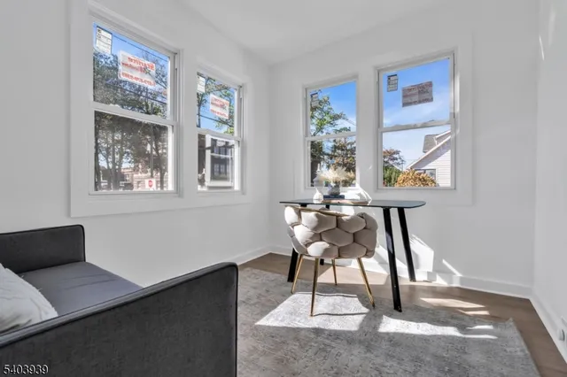 a view of a livingroom with furniture and a window