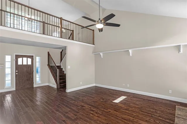 a view of an entryway with wooden floors