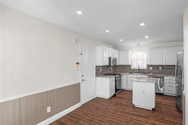 a view of entryway with wooden floor
