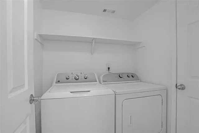 a bathroom with a sink mirror and toilet