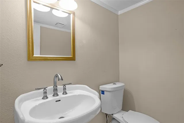 a bathroom with a double vanity sink mirror double and bathtub