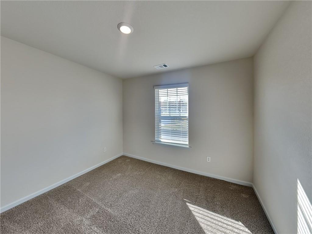 1205 Fendt Drive Locust Grove, GA 30248 - Photo 12 of 19 an empty room with a window