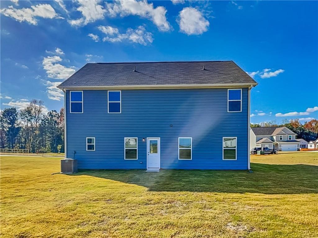 1205 Fendt Drive Locust Grove, GA 30248 - Photo 18 of 19 a view of a house with a swimming pool