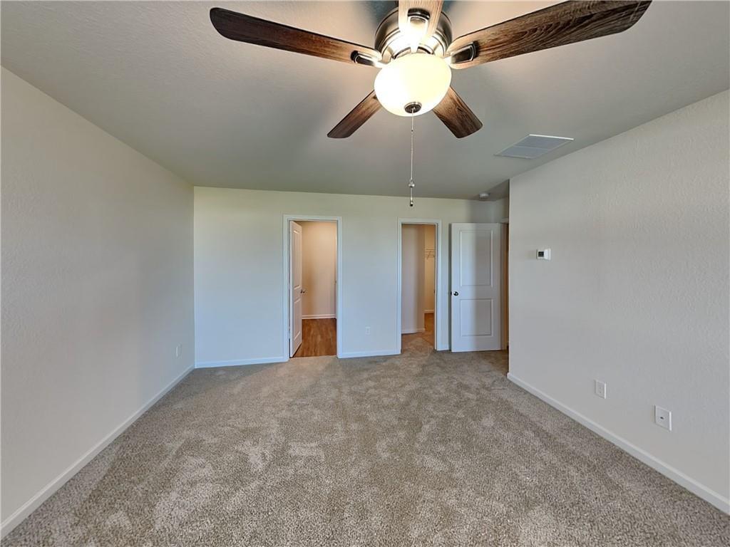 1205 Fendt Drive Locust Grove, GA 30248 - Photo 6 of 19 a view of an empty room with a chandelier fan