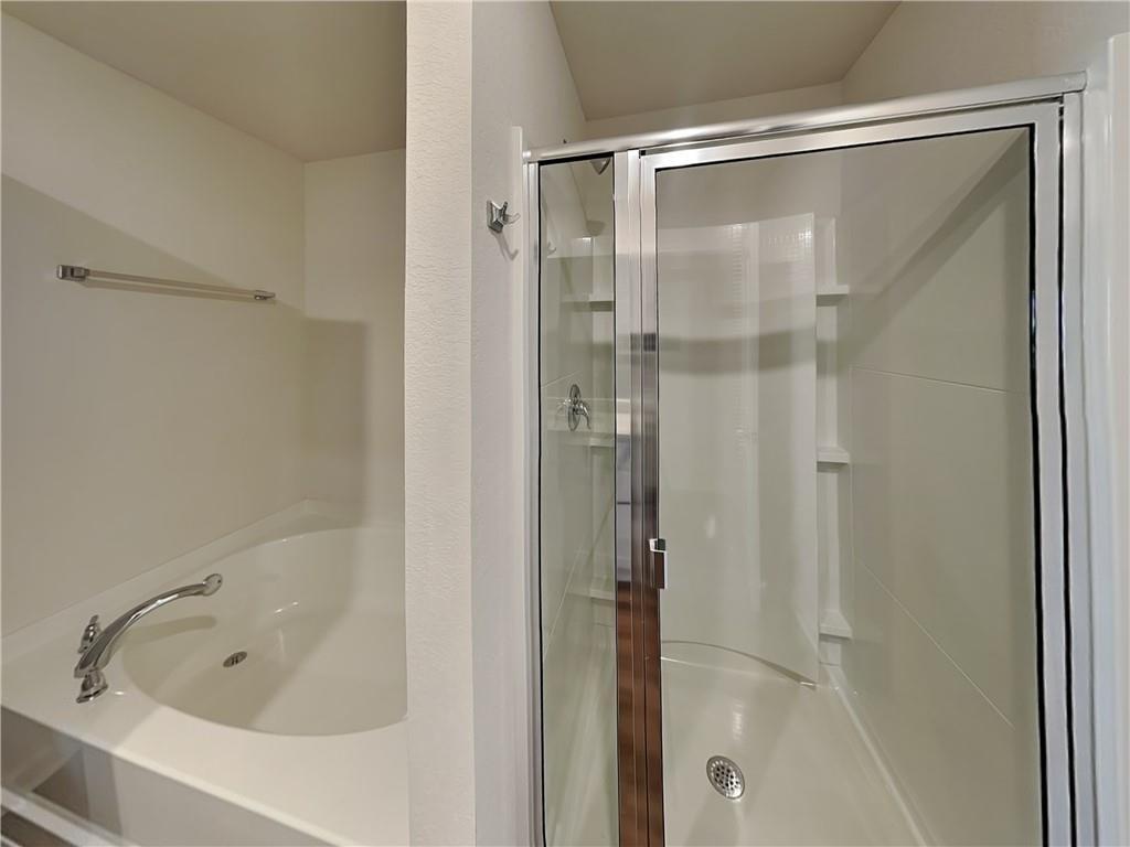 1205 Fendt Drive Locust Grove, GA 30248 - Photo 9 of 19 a bathroom with a glass shower door