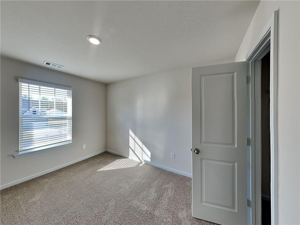 1205 Fendt Drive Locust Grove, GA 30248 - Photo 10 of 19 a view of an empty room with a window