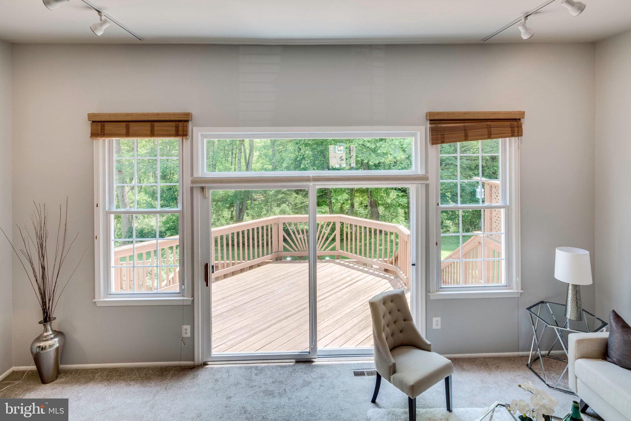 8306 Uxbridge Court Springfield, VA 22151 - Photo 15 of 50 Living Room with large windows and SGD