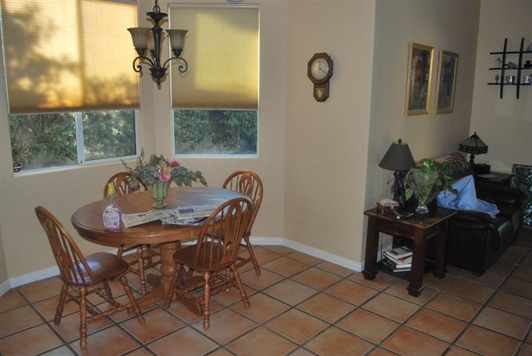 6 Queens Court Rancho Mirage, CA 92270 - Photo 6 of 6 a view of a dining room with furniture and window