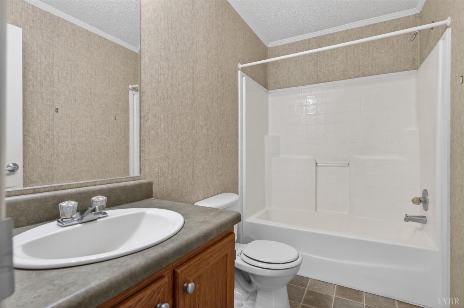 1811 Mohawk Road Gladys, VA 24554 - Photo 20 of 51 a bathroom with a sink toilet a mirror and shower