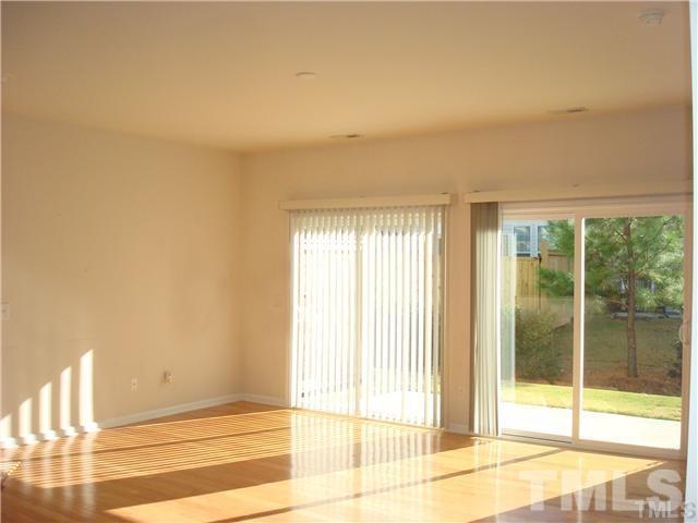8717 Redcrest Place Raleigh, NC 27617 - Photo 4 of 18 a view of an empty room with a window