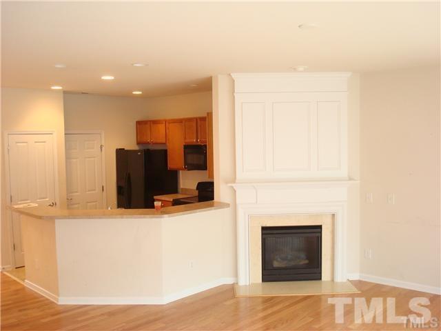 8717 Redcrest Place Raleigh, NC 27617 - Photo 5 of 18 a living room with fireplace furniture and a flat screen tv