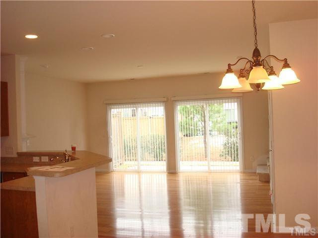 8717 Redcrest Place Raleigh, NC 27617 - Photo 7 of 18 a view of a kitchen with a stove and a window