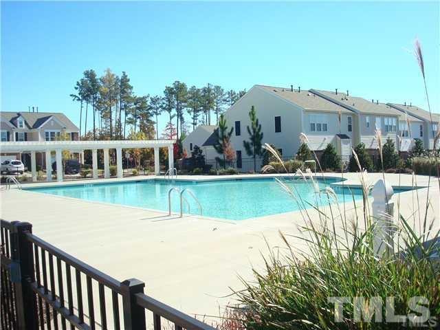 8717 Redcrest Place Raleigh, NC 27617 - Photo 10 of 18 a view of a house with a swimming pool
