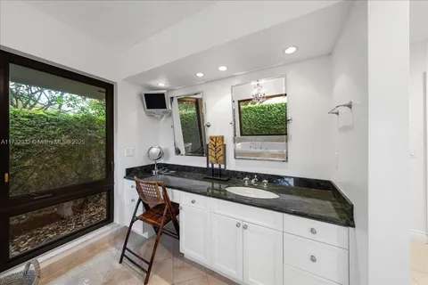 a kitchen with a sink and a large window