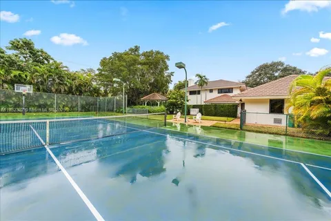 a view of a swimming pool with a yard
