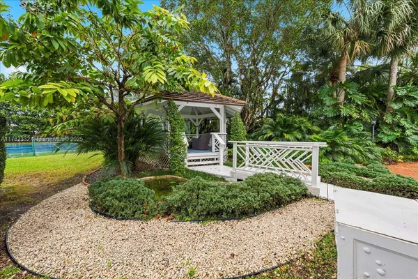 a view of a garden with a bench in it