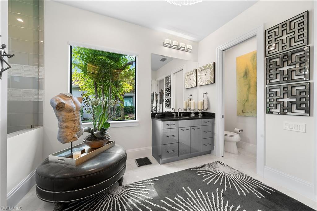 12499 Twin Eagles Boulevard Naples, FL 34120 - Photo 20 of 50 a living room with furniture and a rug