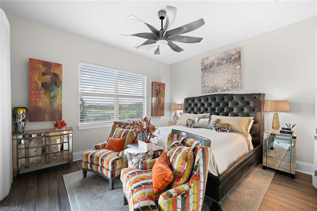 12499 Twin Eagles Boulevard Naples, FL 34120 - Photo 30 of 50 a bedroom with bed and wooden floor