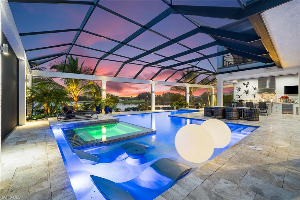 12499 Twin Eagles Boulevard Naples, FL 34120 - Photo 3 of 50 a view of a swimming pool with a patio