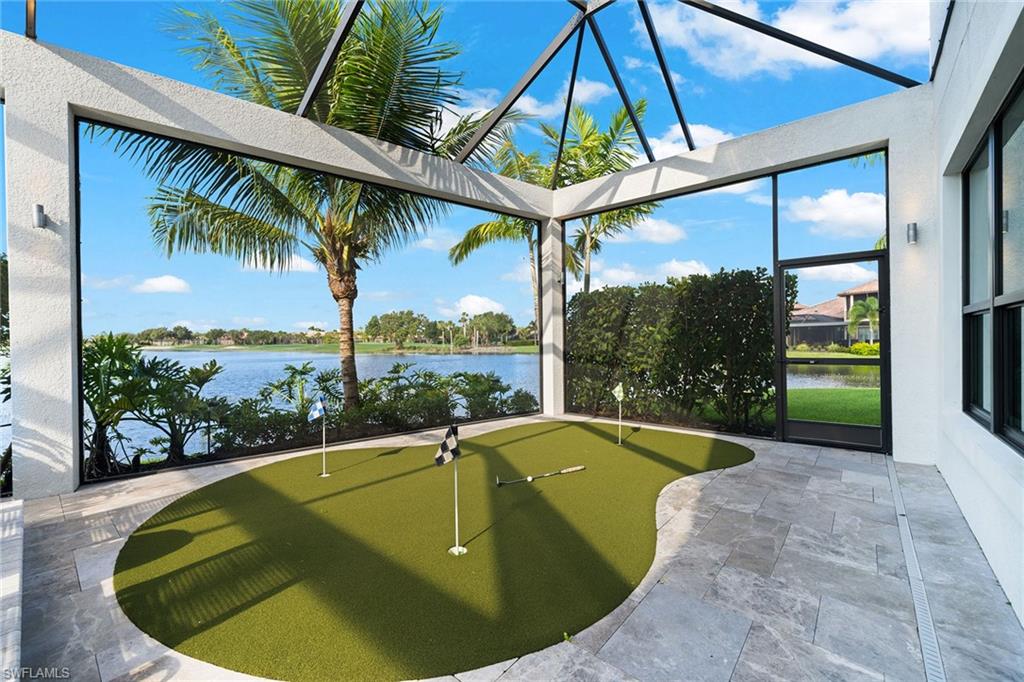 12499 Twin Eagles Boulevard Naples, FL 34120 - Photo 33 of 50 a view of a swimming pool with a patio