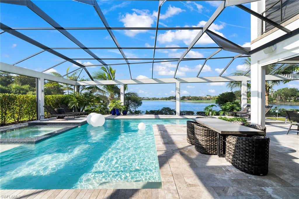 12499 Twin Eagles Boulevard Naples, FL 34120 - Photo 38 of 50 a view of a swimming pool with a patio