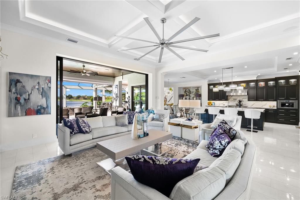 12499 Twin Eagles Boulevard Naples, FL 34120 - Photo 4 of 50 a living room with furniture and a large window